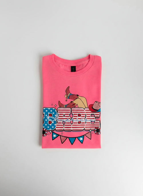 Pink t-shirt with graphic design on a gray background